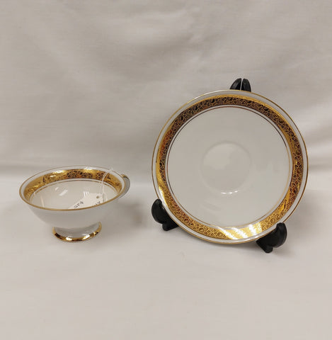 White and Gold Cup and Saucer