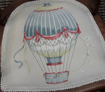 English child's chair with upholstered hot air balloon pattern