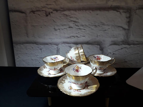 Five demi tasse cups and saucers